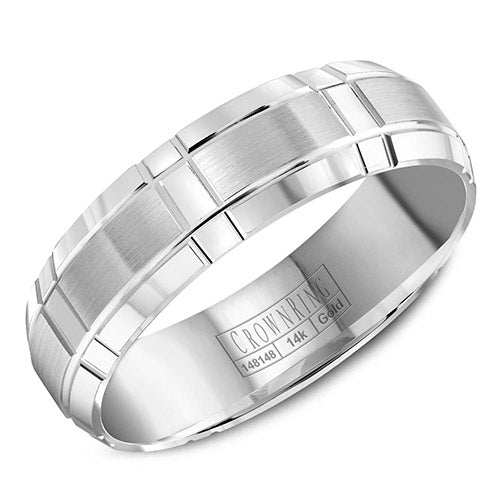 A white gold wedding band with a brushed center and intricate line detailing.