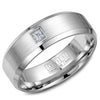 A white gold wedding band with beveled edges, a brushed center and a princess cut diamond.
