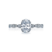 Oh-val Delight! The oval shaped center diamond is complemented with brilliant round diamonds scattered within unique marquis shaped designs. With crisp double prongs securing the oval shaped diamond, this one of a kind engagement ring will sparkle anyway you look at it. Let this heirloom inspired ring be a stunning testament to your endless love.