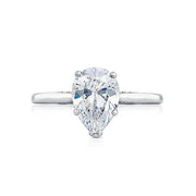 Let your brilliant pear shaped center shine in this timeless engagement ring. A sleek high polished ring with hidden diamond details along the inner face brings your pear shaped center to life.