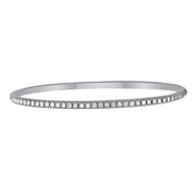 A beautiful, classic diamond bangle that you can add to any stack bracelet look. This gorgeous white gold bracelet has 1.00ctw diamonds that are G-H in color, SI in clarity glimmering from the top side of the bangle. Pair this striking design with another diamond bracelet from Moyer!