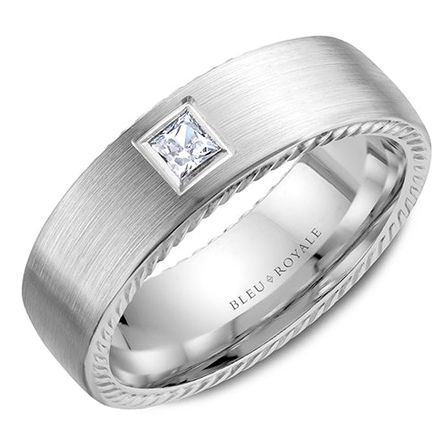 A brushed white gold wedding band with a princess diamond and milgrain detailing. This ring is available in 14K, 18K (White, Yellow & Rose gold), Platinum 950 & Palladium, please call for pricing.