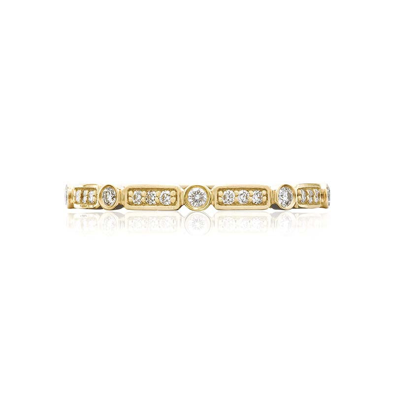 For the bold Tacori Girl; looking for a wedding band to show off her unique style. Bezel set brilliant round diamonds are enveloped in circular and rectangular yellow gold baskets for a modern band that shell never want to take off.Size: approx. 2mm wi