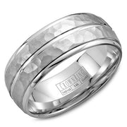 A white gold wedding band with a hammered finish and line detailing.
