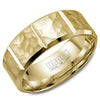 A yellow gold wedding band with a hammered finish and notch detailing.