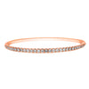 This diamond bracelet presents a neat row diamonds set on the top side of this rose gold bracelet. Simply sophisticated, this bangle bracelet shimmers with round-cut diamonds set in 18k gold.