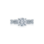 The clean cut round brilliant center diamond hovers over the intricate ribbon twisting pattern of the foundation. The diamonds on the ceiling of this amazing Tacori engagement ring seem to fold over the edge like a gentle lace-like blanket. 