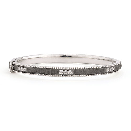 From the JudeFrances Silver Collection, the JudeFrances Silver Simple Lisse Bangle features round faceted white topaz pave set in sterling silver with black rhodium with the signature brushed JFJ finish and beaded edge.