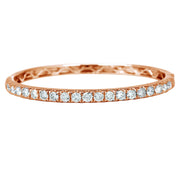 The majestic diamond bangle with superior craftsmanship is sure to be remembered for its striking beauty and design. Simply sophisticated, this bangle bracelet shimmers with round-cut diamonds set in 18K Rose Gold. The diamonds are G-H in color, SI in clarity. 