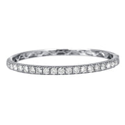 The majestic diamond bangle with superior craftsmanship is sure to be remembered for its striking beauty and design. Simply sophisticated, this bangle bracelet shimmers with round-cut diamonds set in 18K White Gold. The diamonds are G-H in color, SI in clarity. 