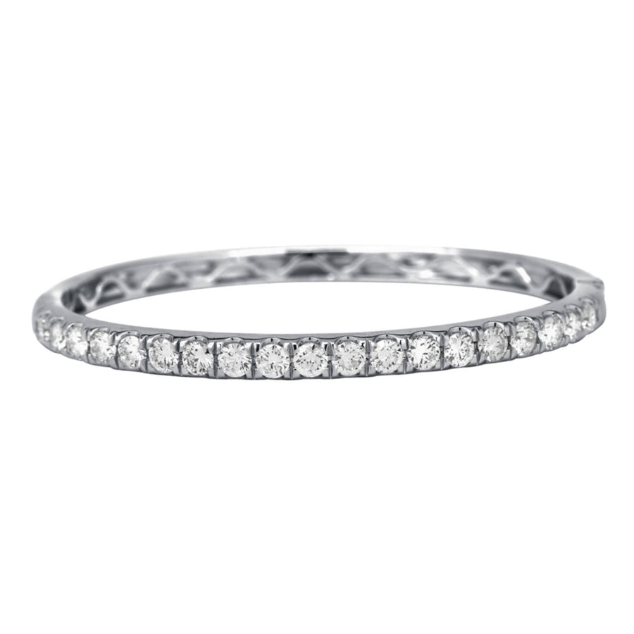 The majestic diamond bangle with superior craftsmanship is sure to be remembered for its striking beauty and design. Simply sophisticated, this bangle bracelet shimmers with round-cut diamonds set in 18K White Gold. The diamonds are G-H in color, SI in clarity. 