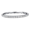 The majestic diamond bangle with superior craftsmanship is sure to be remembered for its striking beauty and design. Simply sophisticated, this bangle bracelet shimmers with round-cut diamonds set in 18K White Gold. The diamonds are G-H in color, SI in clarity. 