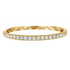 The majestic diamond bangle with superior craftsmanship is sure to be remembered for its striking beauty and design. Simply sophisticated, this bangle bracelet shimmers with round-cut diamonds set in18K Yellow Gold. The diamonds are G-H in color, SI in clarity. 