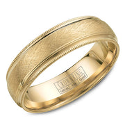 A yellow gold wedding band with a textured center and milgrain detailing.