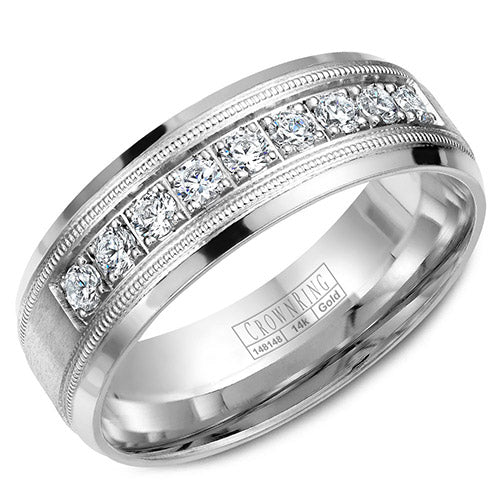 A white gold wedding band with milgrain details and nine round cut diamonds.