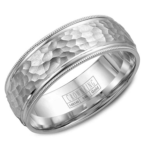 A white gold wedding band with a hammered center and milgrain detailing.