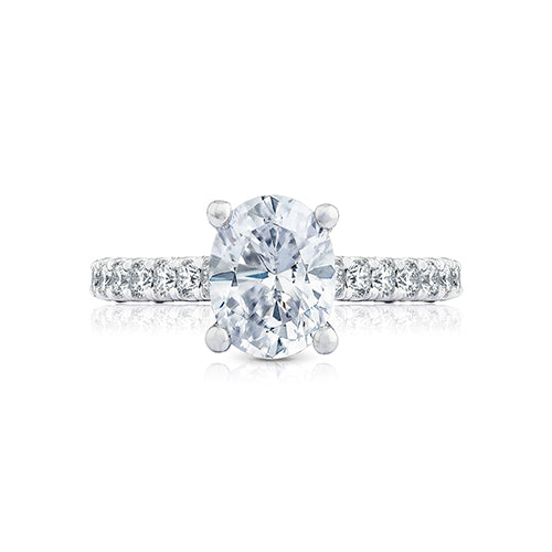 Beauty from every angle. An exquisite French cut setting reveals more diamond and less metal, while the brilliant diamonds graduate into the oval center. With an open air carriage, you can see your oval center shine brilliantly from every angle.