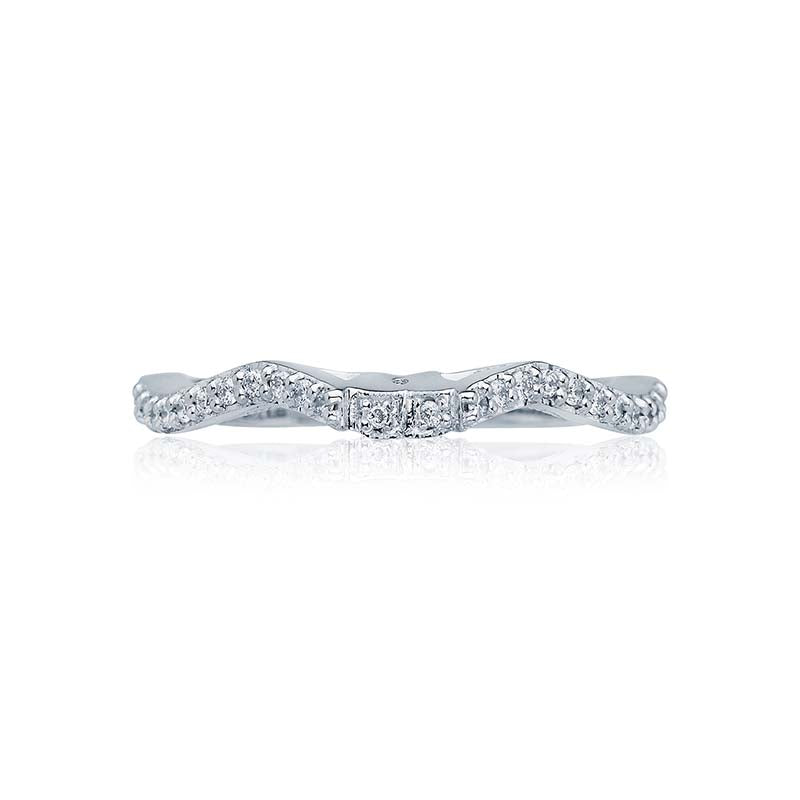 A string of diamonds made to perfectly pair with several Tacori ribbon-twist rings; creating a comfortably flush look for a beautiful and dynamic duo.Total Carats in wedding ring as pictured equal approximately  0.18Metal Shown: Platinum