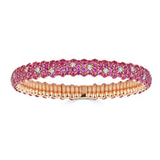 This gorgeous rose gold bracelet has 12.67ctw Pink Sapphire and 0.79ctw diamonds. ZYDO ITALY has created a spring technology which allows their diamond bracelets and rings to be pulled, twisted, flexed and otherwise manipulated without breaking or losing their shape! In addition to the all diamond bracelet and rings, ZYDO has styles showcasing colored gemstones such as blue sapphire and pink sapphire. The bracelets and rings are also available in white, yellow or rose gold.  