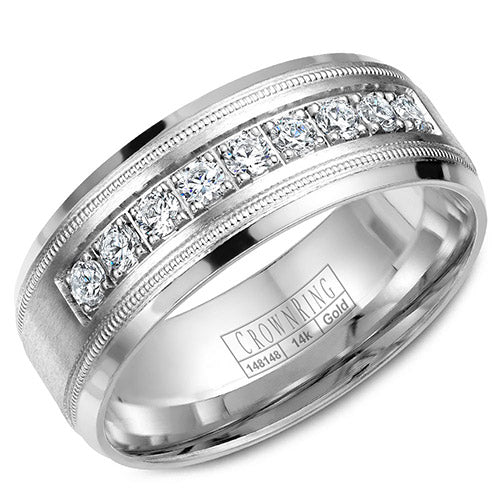 A wedding band with nine round diamonds and milgrain detailing.