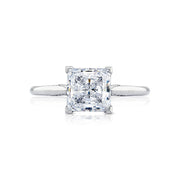 Let your brilliant princess center shine in this timeless engagement ring. A sleek high polished ring with hidden diamond details along the inner face brings your princess center to life.