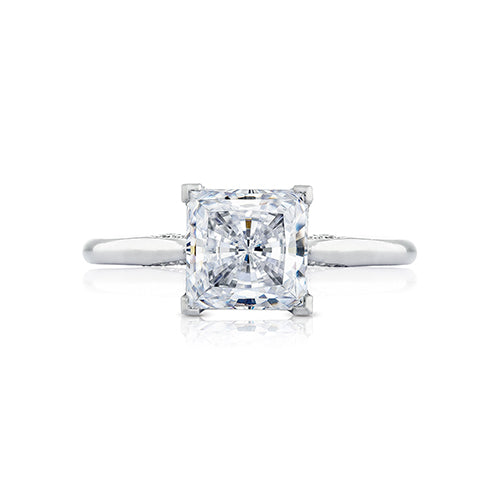 Let your brilliant princess center shine in this timeless engagement ring. A sleek high polished ring with hidden diamond details along the inner face brings your princess center to life.