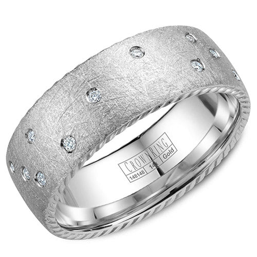 A wedding band in white gold with 21 diamonds and rope detailing on the sides.