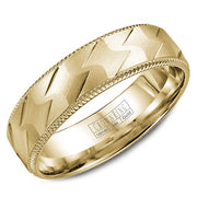 A yellow gold wedding band with a patterned center and milgrain detailing.