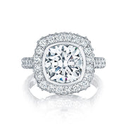 A cushion cut center diamond is brought to life by a starlit crown and spotlight diamonds. pav? set diamonds along the band enhance the beauty of this stunning ring; taking her breath away at first sight.  RoyalT designs are only available in platinum; 18kt Rose Gold, 18kt Yellow Gold.