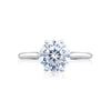 Let your brilliant round center shine in this timeless engagement ring. A sleek high polished ring with hidden diamond details along the inner face brings your round center to life.This engagement ring can accommodate a variety of center diamond sizes.