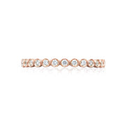 Take her breath away with a beautiful round diamond bezel set wedding band letting each diamond droplet represent a loving memory that only the two of you know. Set within rose gold; this band is simply irresistible.Size: approx. 2mm wide