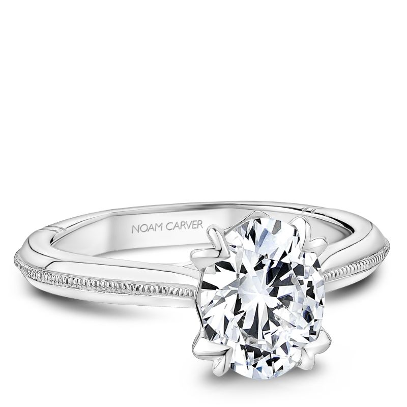 Oval shape Atelier engagement ring with signature prongs in platinum