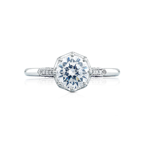 An engagement ring fit for the Tacori Queen. Featuring a renaissance crown; your round center sits on a regal throne for a ring that is worthy of your love story. Brilliant pav ? diamonds dance along the ceiling of the high polished band with hidden diamonds.
