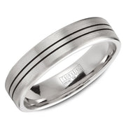 A wedding band in white gold with a brushed center and line detailing.