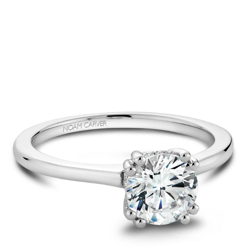 White gold solitaire engagement ring with 8 round diamonds