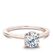 Rose gold solitaire engagement ring with a plain band