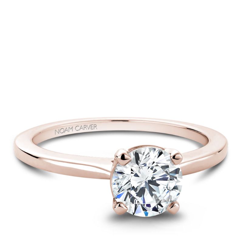 Rose gold solitaire engagement ring with a plain band