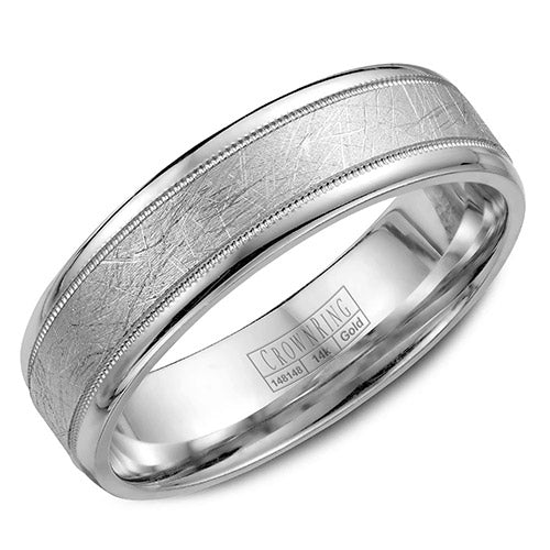 A white gold wedding band with a textured center and milgrain detailing.