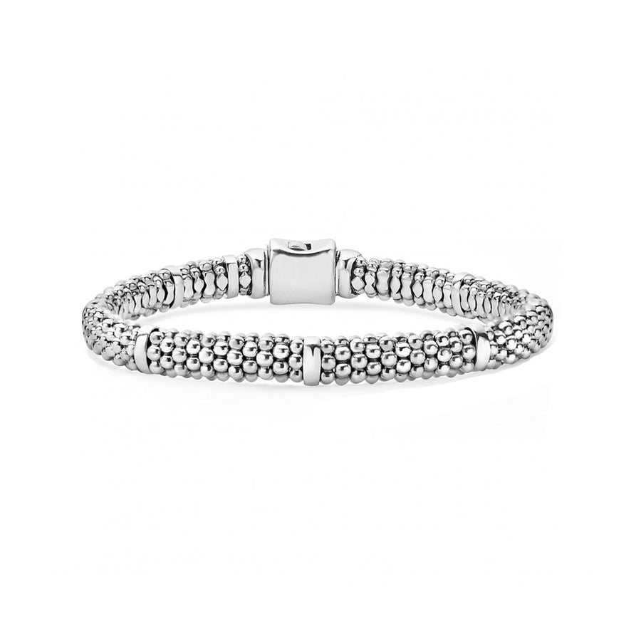 Seven smooth stations highlight the sterling silver Caviar beading on this signature bracelet. Finished with a box clasp that displays the LAGOS crest.- Sterling Silver- Box Clasp- Rope Width 6mm- STYLE #: 05-80602-7
