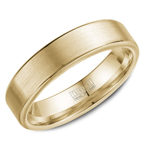 A wedding band in yellow gold with a brushed center and polished edges.