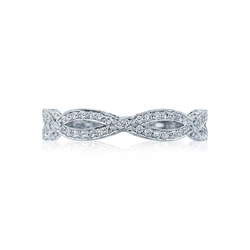 Eternal love. Platinum panels scattered with diamonds sparkle along a woven ribbon twist. A delicate silhouette of lace-like diamonds; creates a phenomenal profile to last a lifetime. 