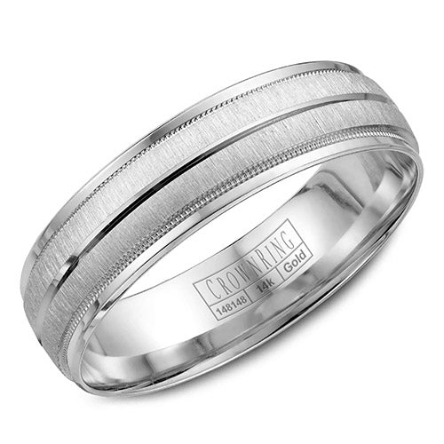 A textured white gold wedding band with line and milgrain detailing.