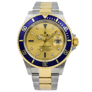 This Rolex Submariner with a Serti Dial was recently traded in to our store and is in very good condition. This model features a champagne color dial with diamonds and blue sapphire indices. The watch is two-tone with 18k yellow gold and stainless steel. The year on this piece is circa 2002 with a Y serial.  