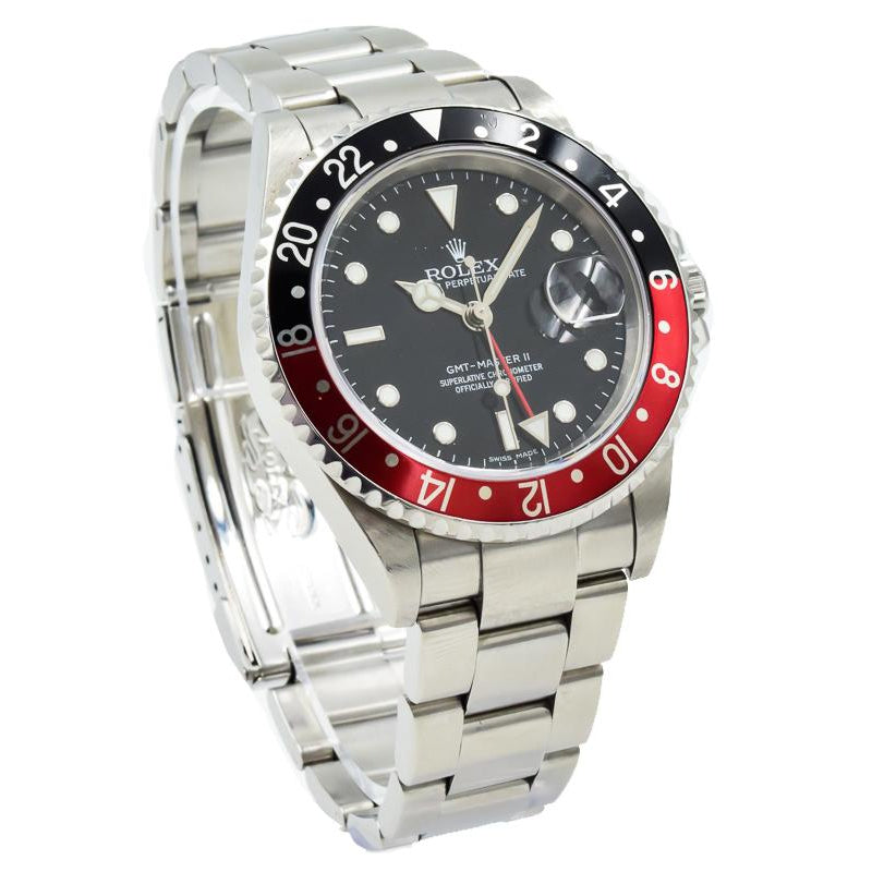 This Rolex GMT-Master II was recently traded in to our store and is in very good condition! This watch was taken in with the full box, papers, and even the original hang tags! Beginning in 1989, the Reference 16710 replaced the ref. 16760 featuring a slimmer case design with a similar caliber movement. This model has the Coke colored bezel. The bezel is stainless steel with black and red.This piece was sold in 05/2019. If you are looking for this or something similar, please reach out to us!