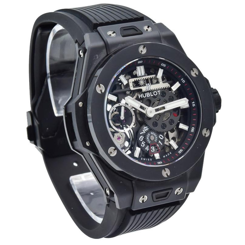 This Hublot Big Bang MECA-10 Black Magic was recently traded in and is in excellent condition! This watch has a 45mm black ceramic case. It has a skeleton dial along with a sapphire crystal exhibition caseback. The black rubber strap utilizes the Hublot quick release system for quick and easy strap changes. The dial features 2 power reserve indicators, one showing the days and another is an indicator from the left to right.  As an authorized dealer for Hublot, we have inspected this piece to be 