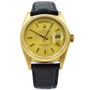 This vintage Rolex President was recently traded in, this will be an excellent Presidential Rolex to pick up for a pre-owned value! This watch features an 18k Yellow Gold case and the day-date movement.  The strap is an aftermarket black alligator strap and buckle since the original gold bracelet was not included. There are some scratches and very minor chips on the edge of the crystal from wear from the previous owner.  This Rolex President is a Day-Date watch is in overall good condition and w
