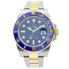 This Rolex Submariner was recently traded in to our store and comes with the original box and warranty card. This watch is in very good condition and shows only normal, minor wear. This model is in a 40mm stainless steel case featuring 18k Yellow Gold accents. The dial and ceramic bezel are blue.