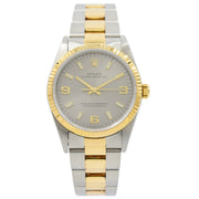 This Rolex Oyster Perpetual was recently traded in to our store and comes with the full box and papers. This piece is in very good condition and was just serviced in 2019. This watch still has the original sticker on the caseback, which is extremely unusual for a piece of this age. This model is two-tone with stainless steel and 18k yellow gold with a silver dial. The links do have some minor discoloration between them, which is normal for the age of this piece.