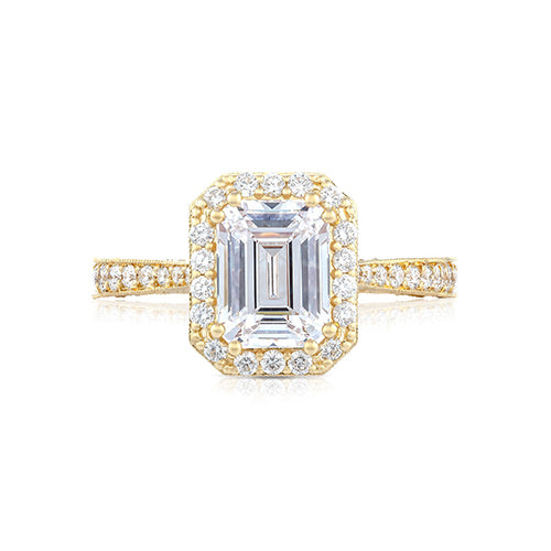 Diamonds from every angle bring your center diamond to life. Graduating pav set diamonds set _ of the way on a sleek and slim yellow gold band make way for the grand finale, your emerald cut center diamond spotlighted by an intense pav set diamond bloom. Intricate diamond crescent details on the inner face of the ring, make for an irresistible stunner.Diamond Carat Weight (not including center diamond): 1.00 ctw