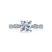 Elegant marquise shapes flourish along the diamond band of this simply stunning solitaire with crescent engraving and milgrain details adorning the side profile.This engagement ring can accommodate a variety of center diamond sizes; starting at 1 carats